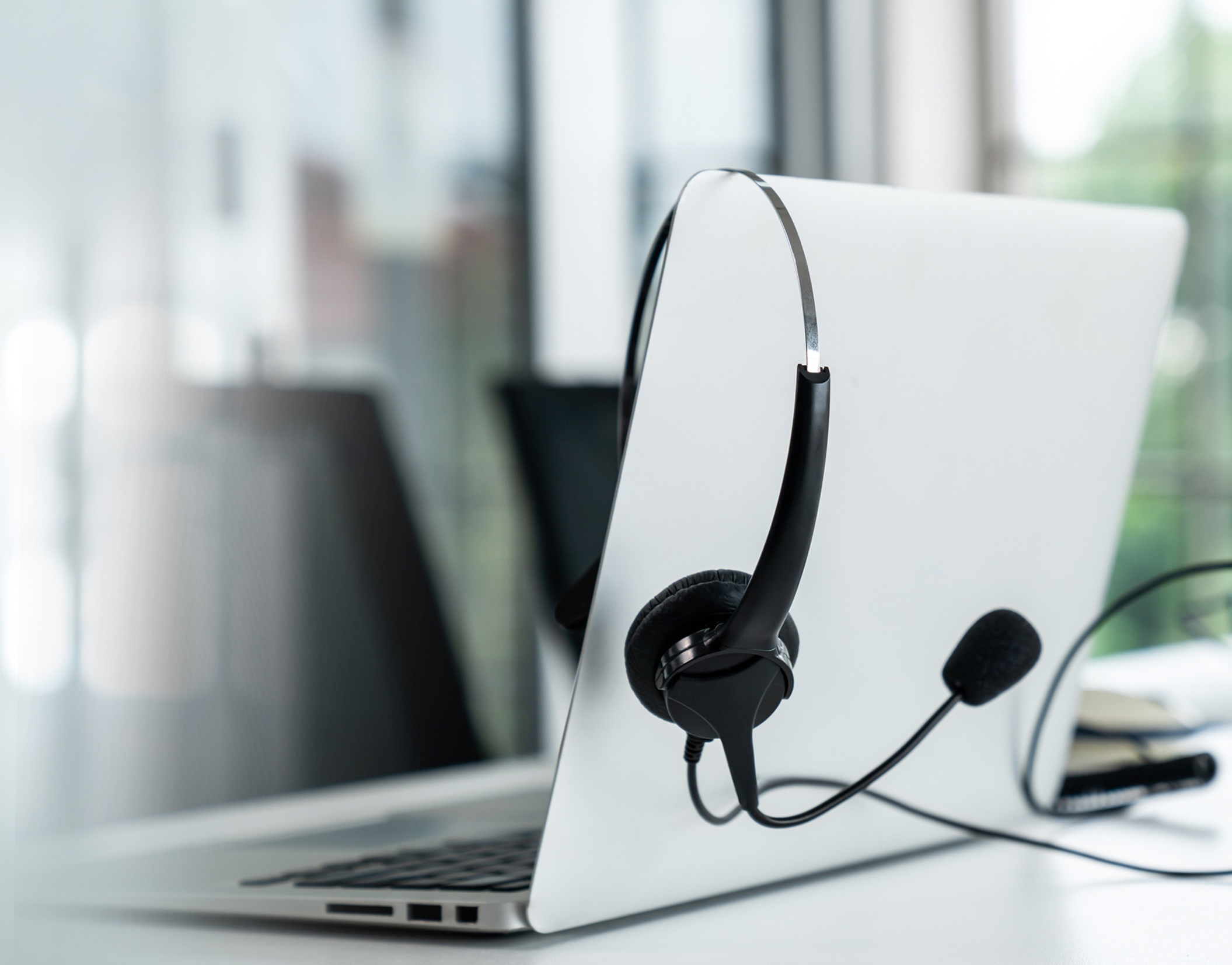 Headset and customer support equipment at call center ready for actively service . Corporate business help desk and telephone assistance concept .